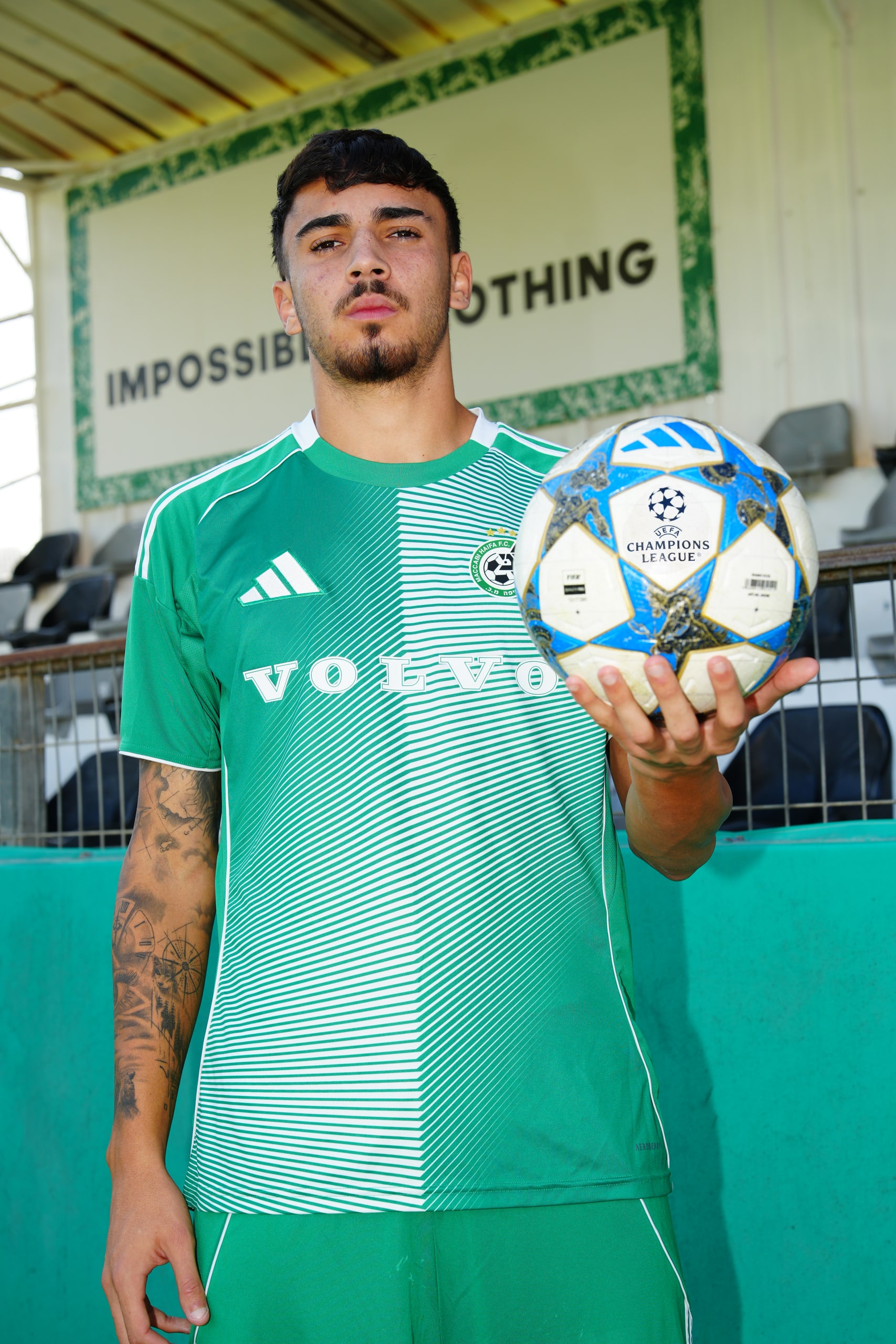 Player presenting the UEFA Champions League ball