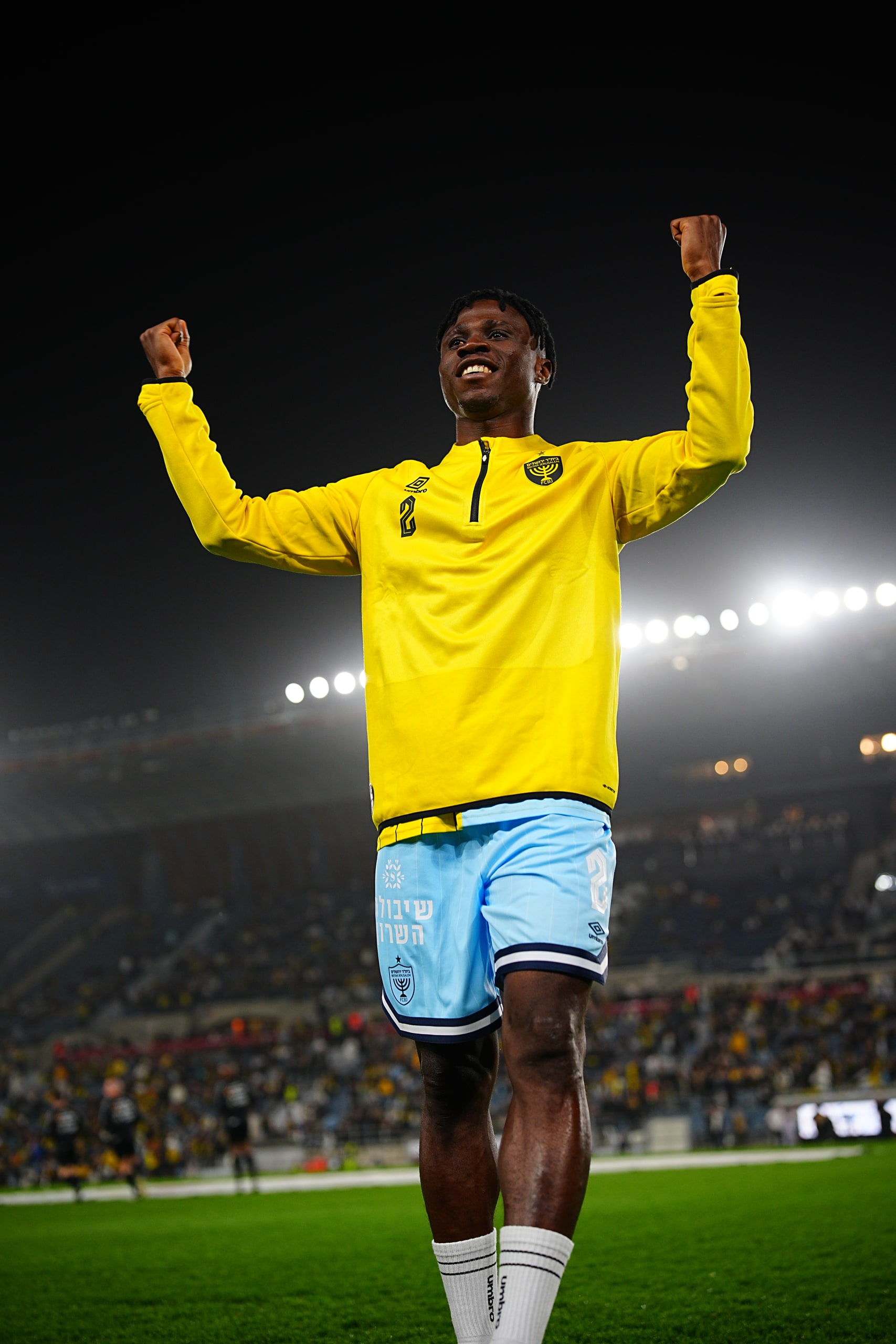Player stretching before the match